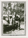 Harold Neu and man sitting on the hood of a car